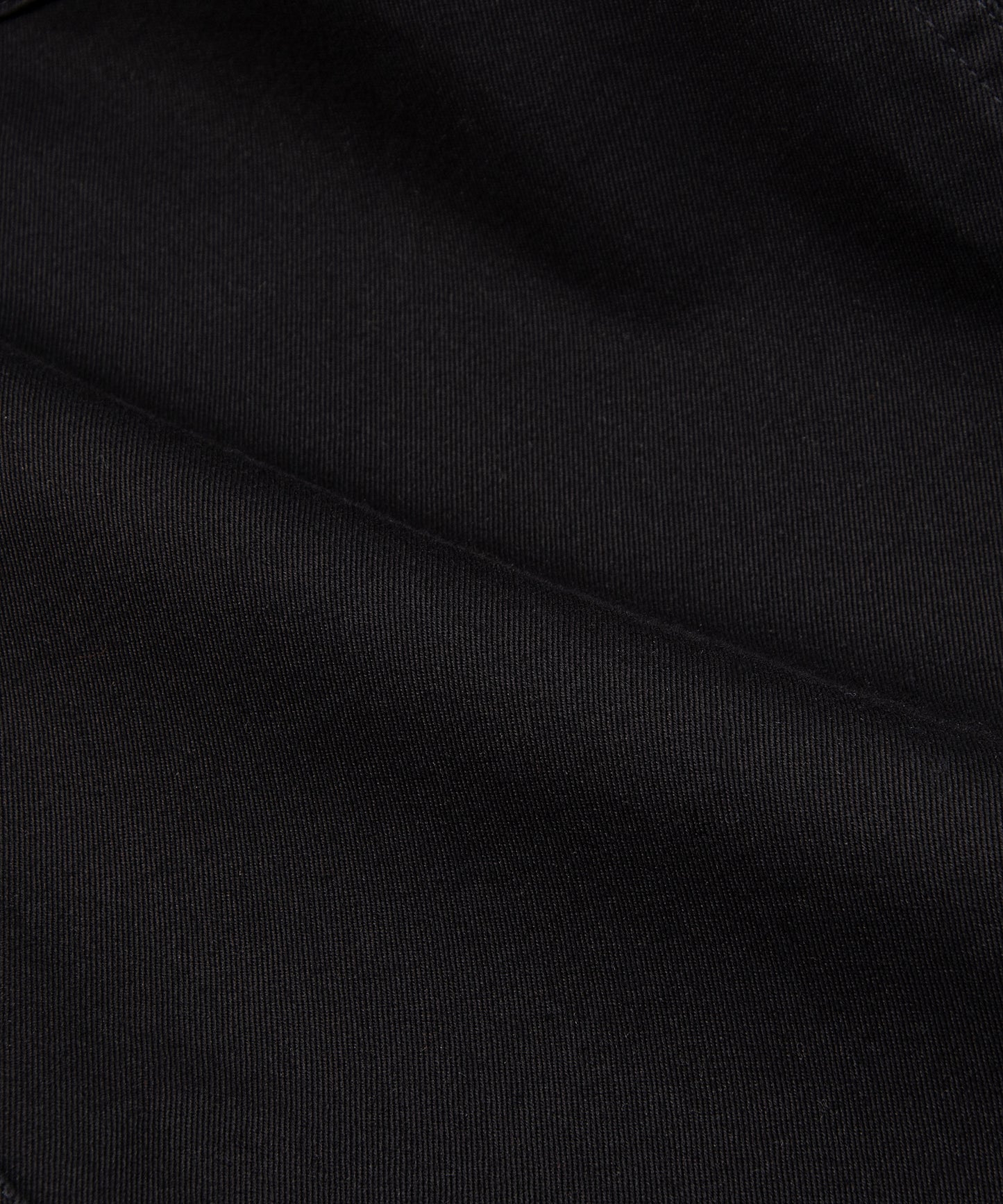 CUSTOM_ALT_TEXT: Fabric closeup on Paper Planes Flare Cargo Pant, color Black.