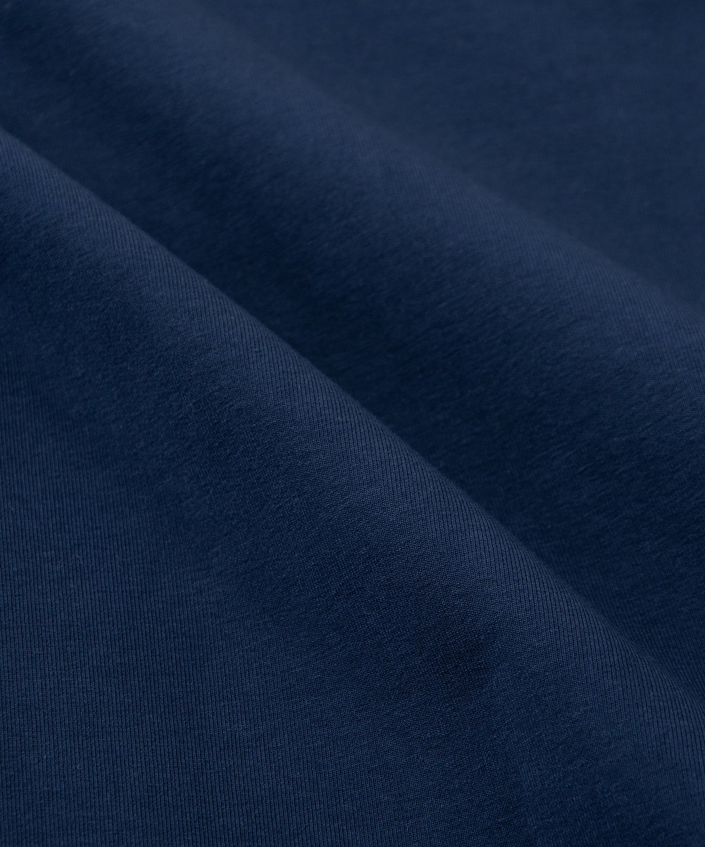 CUSTOM_ALT_TEXT: Fabric closeup on Paper Planes Chromatic Crewneck Sweatshirt color Naval Academy.