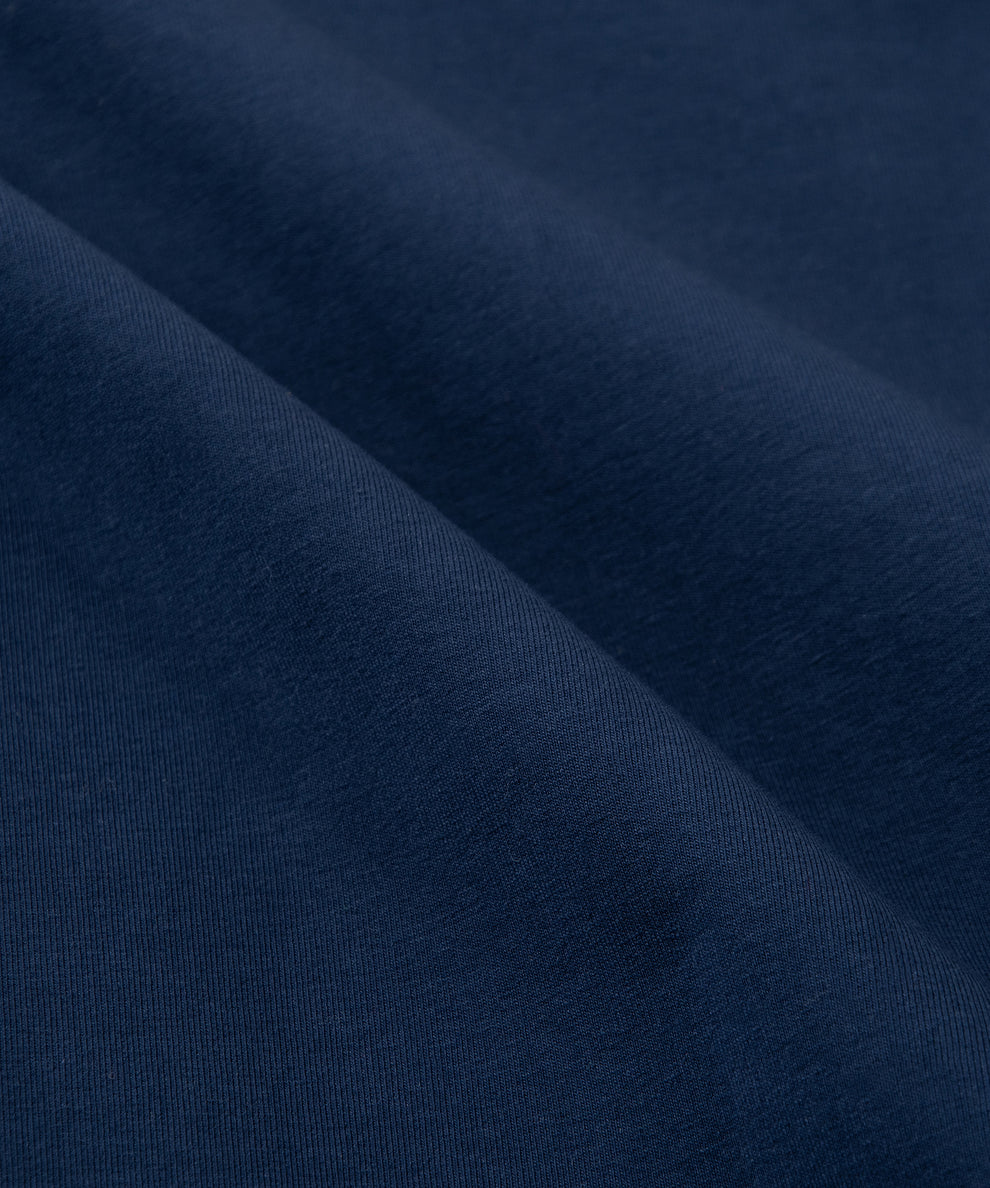 CUSTOM_ALT_TEXT: Fabric closeup on Paper Planes Chromatic Crewneck Sweatshirt color Naval Academy.