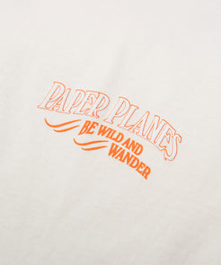 CUSTOM_ALT_TEXT: Print closeup on Paper Planes Be Wild and Wander Tee, color Vapor.