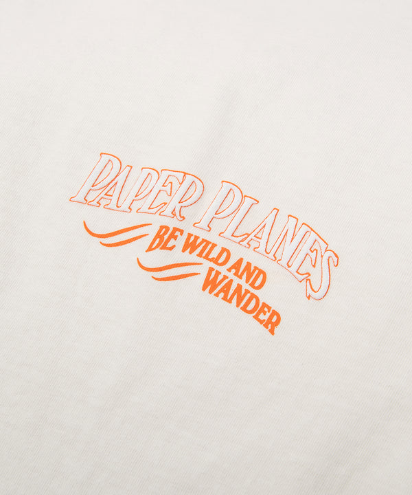 CUSTOM_ALT_TEXT: Print closeup on Paper Planes Be Wild and Wander Tee, color Vapor.