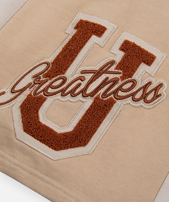 CUSTOM_ALT_TEXT: Greatness U chenille embroidery patch on Paper Planes Greatness U Short.
