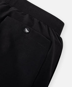 CUSTOM_ALT_TEXT: Back patch pocket with snap closure on Paper Planes Slim Fit Sweatpant, color Black.