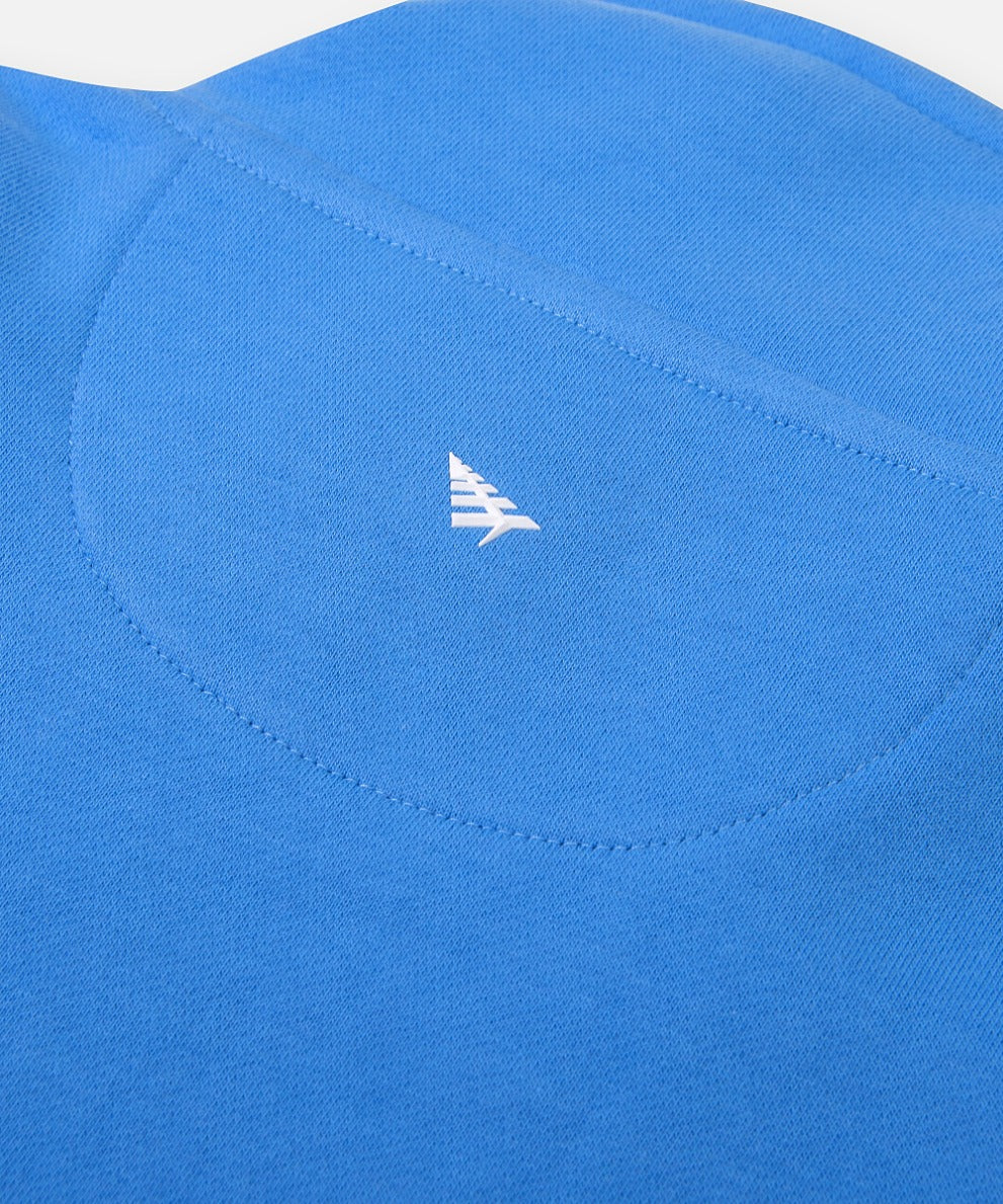  High-density silicone Plane icon centered on half moon stitch at back of Paper Planes Open Hem Half Zip Sweatshirt, color Azure Blue.