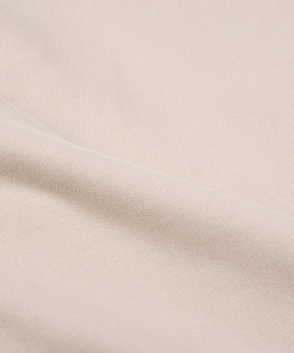  Fabric closeup on Paper Planes The Great Seal Crewneck Sweatshirt, color Moonbeam.