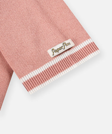 CUSTOM_ALT_TEXT: Paper Planes woven label above sleeve cuff on Paper Planes Sweater Bowling Shirt, color Pale Mauve.