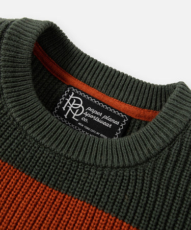 CUSTOM_ALT_TEXT: Ribbed neck and main label on Paper Planes Striped Crewneck Sweater, color Ginger.