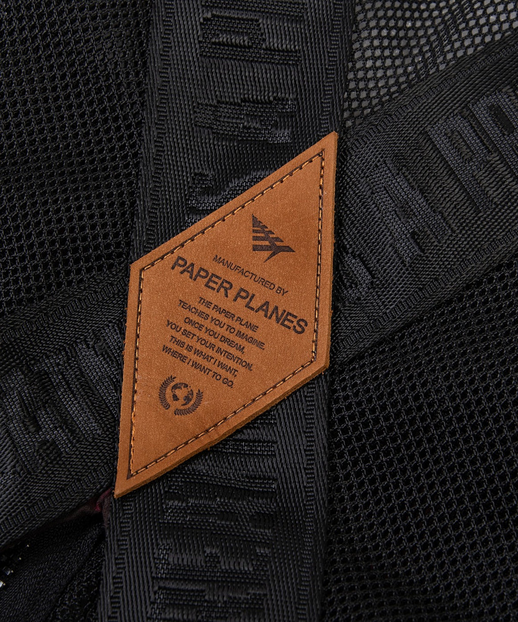  Debossed leather logo appliqué on center back of Paper Planes Wax Cotton + Mesh Tactical Vest.