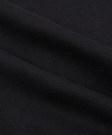 CUSTOM_ALT_TEXT: Fabric closeup on Paper Planes Crest Hoodie, color Black.