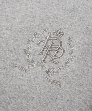 CUSTOM_ALT_TEXT: 3-D embroidered PPL chest crest on Paper Planes Crest Hoodie, color Heather Grey.