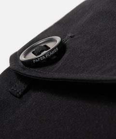  Fabric-looped oversized slot-hole logo-ed button on Paper Planes Cotton Touch Explorer’s Cargo Pant, color Black.
