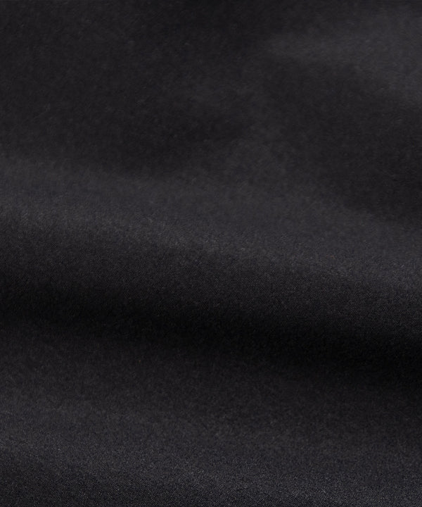 CUSTOM_ALT_TEXT: Fabric closeup on Paper Planes Cotton Touch Explorer’s Cargo Pant, color Black.