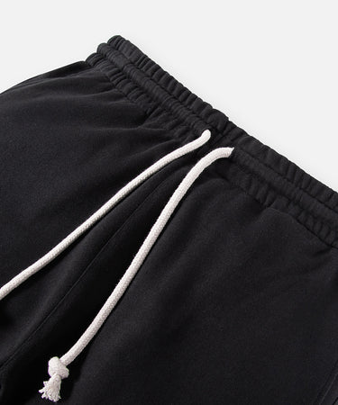 CUSTOM_ALT_TEXT: Elasticated waistband and drawcord on Paper Planes Crest Sweatpant, color Black.
