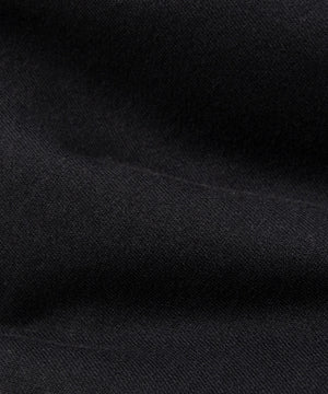 CUSTOM_ALT_TEXT: Fabric closeup on Paper Planes Crest Sweatpant, color Black.