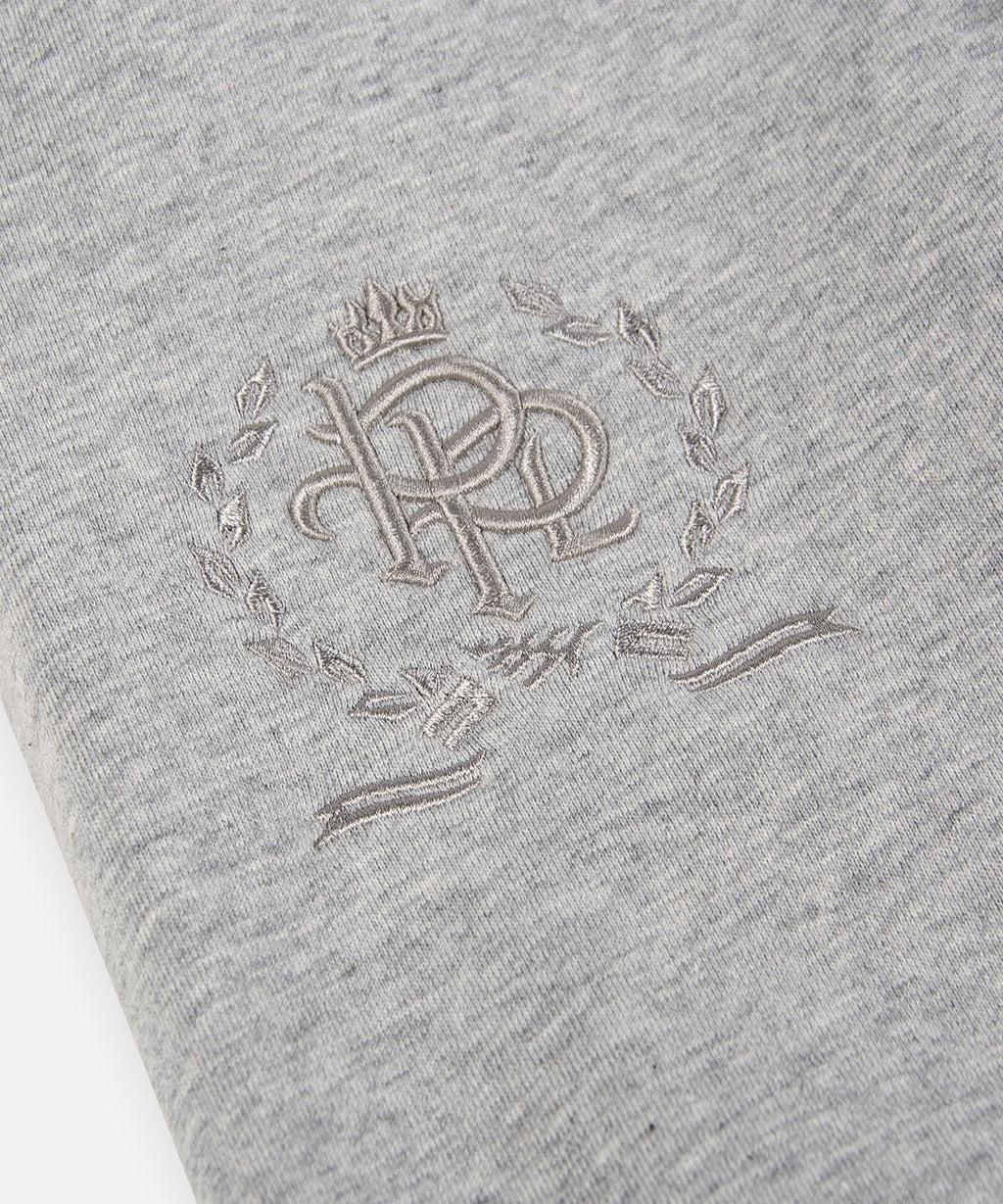  3-D embroidered PPL crest on right thigh of Paper Planes Crest Sweatpant, color Heather Grey.