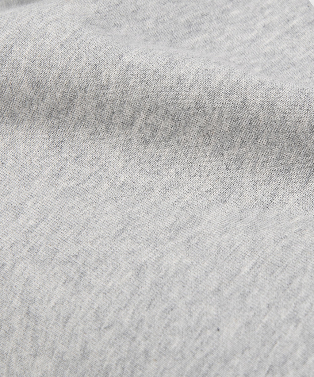  Fabric closeup on Paper Planes Crest Sweatpant, color Heather Grey.