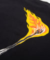 CUSTOM_ALT_TEXT: Closeup of lit match graphic on back of Paper Planes The Spark Tee, color Black.