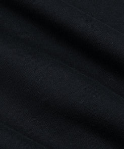 CUSTOM_ALT_TEXT: Closeup of French terry fabric on Paper Planes Mantra Hoodie, color Black.