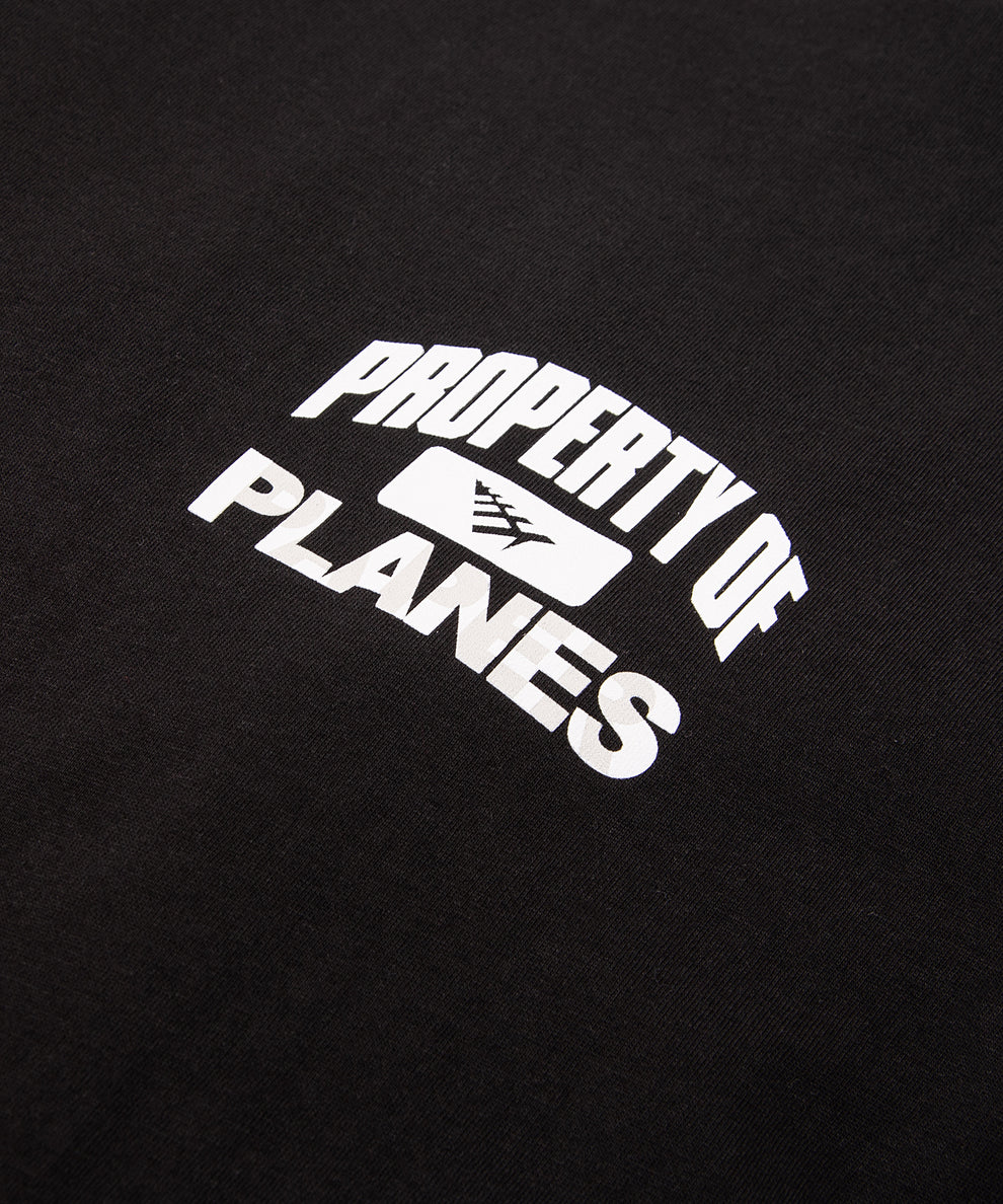 CUSTOM_ALT_TEXT: PROPERTY OF PLANES printed chest artwork on  Paper Planes Athletics Tee, color Black.