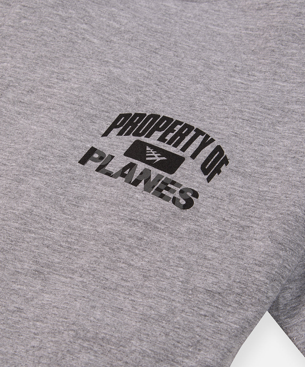 CUSTOM_ALT_TEXT: PROPERTY OF PLANES printed chest artwork on Paper Planes Athletics Tee, color Heather Grey.