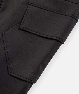 CUSTOM_ALT_TEXT: Angled cargo pocket with flap closure and hidden snaps on Paper Planes Utility Pocket Pant, color Black.