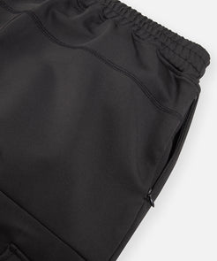 CUSTOM_ALT_TEXT: Hidden on-seam zippered pocket on Paper Planes Utility Pocket Pant, color Black.