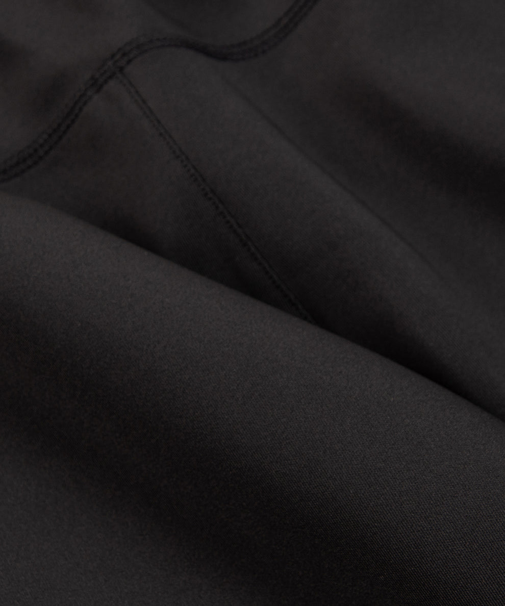 CUSTOM_ALT_TEXT: Interlock fabric closeup on Paper Planes Utility Pocket Pant, color Black.