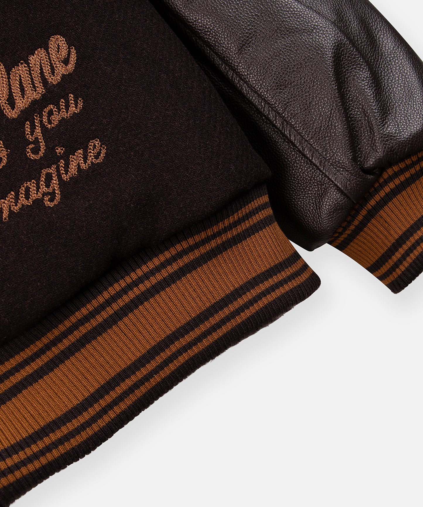 CUSTOM_ALT_TEXT: Striped ribbing at waistband and cuff on Paper Planes Eternally Greatfull Varity Jacket, color Brown.