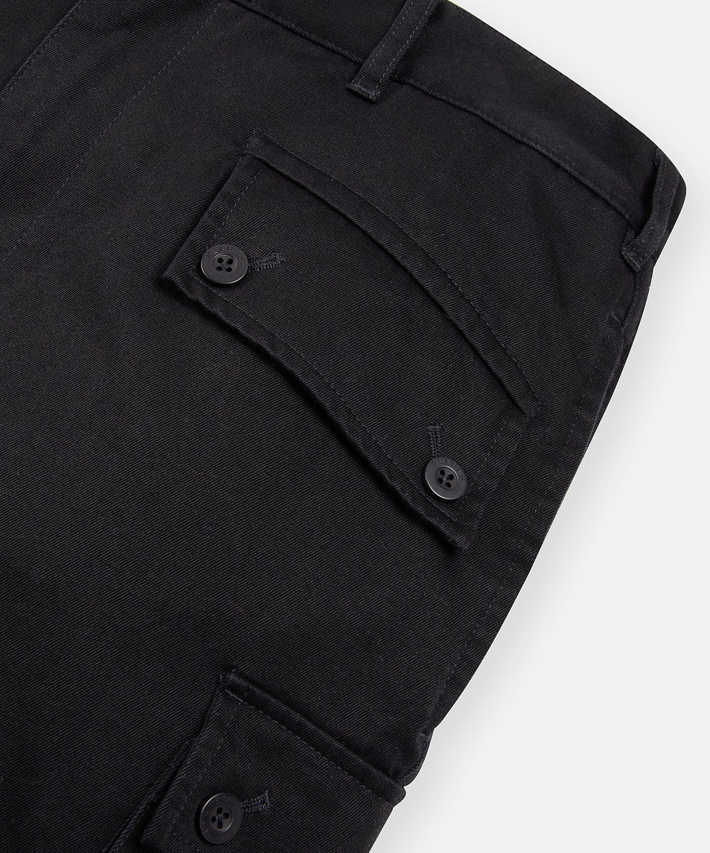 CUSTOM_ALT_TEXT: Back welt pocket with button flap closure on Paper Planes Flare Cargo Pant, color Black.