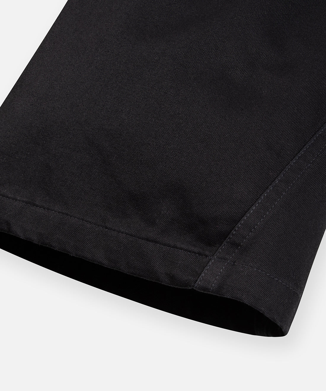 CUSTOM_ALT_TEXT: Gusset at outer leg opening on  Paper Planes Flare Cargo Pant, color Black.