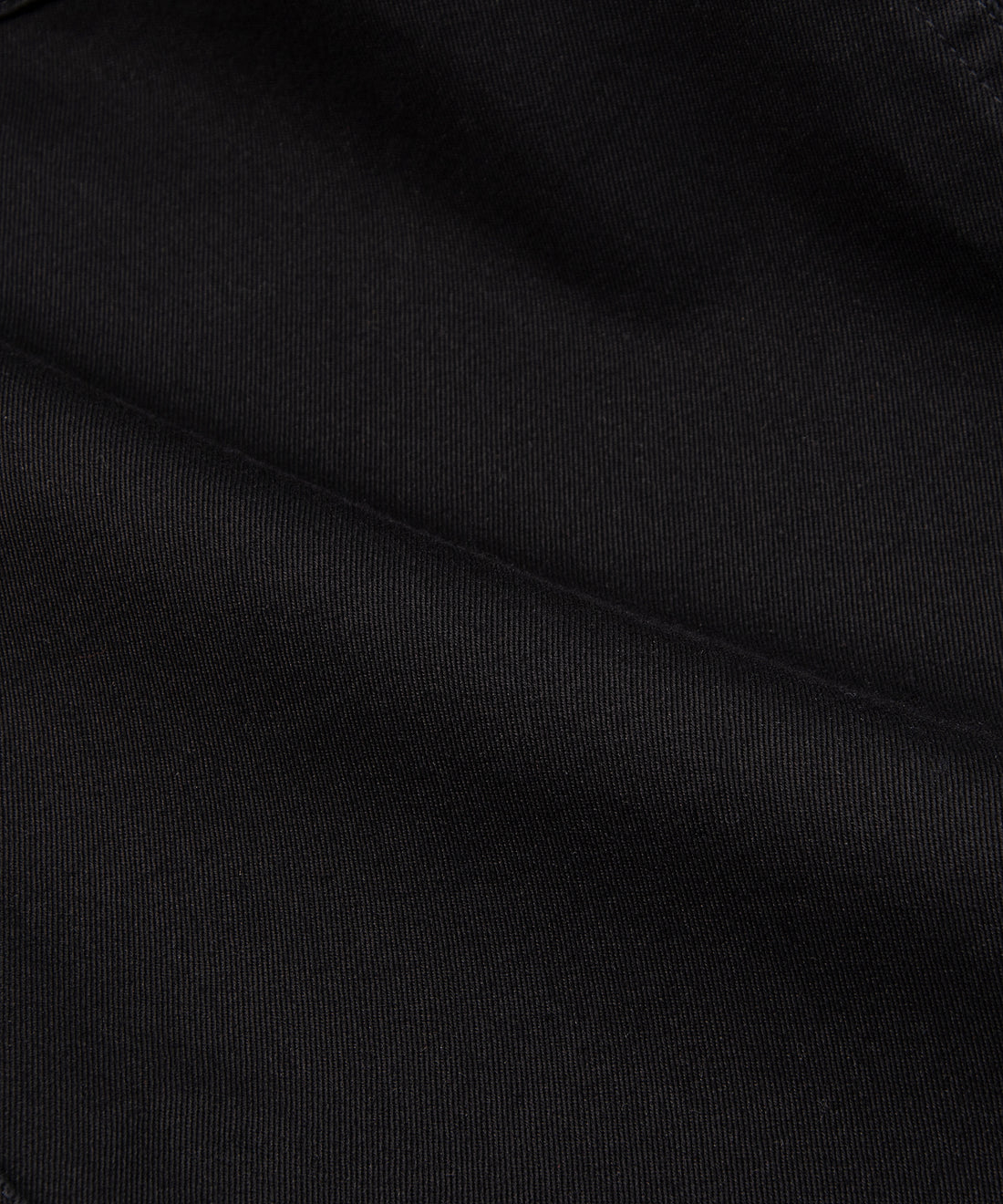 CUSTOM_ALT_TEXT: Fabric closeup on Paper Planes Flare Cargo Pant, color Black.