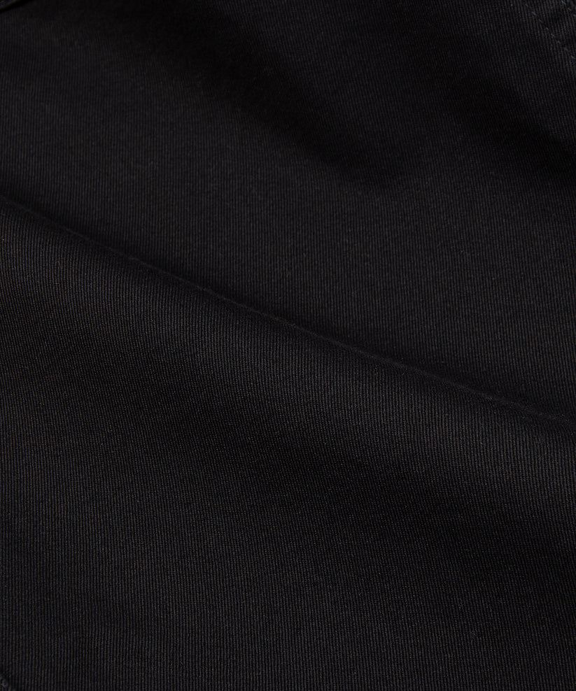 CUSTOM_ALT_TEXT: Fabric closeup on Paper Planes Flare Cargo Pant, color Black.