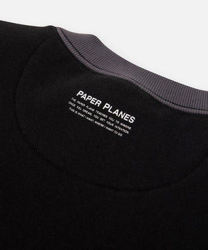 CUSTOM_ALT_TEXT: Planes mantra printed on center back neck of Paper Planes Dream Lab Sweatshirt, color Black.