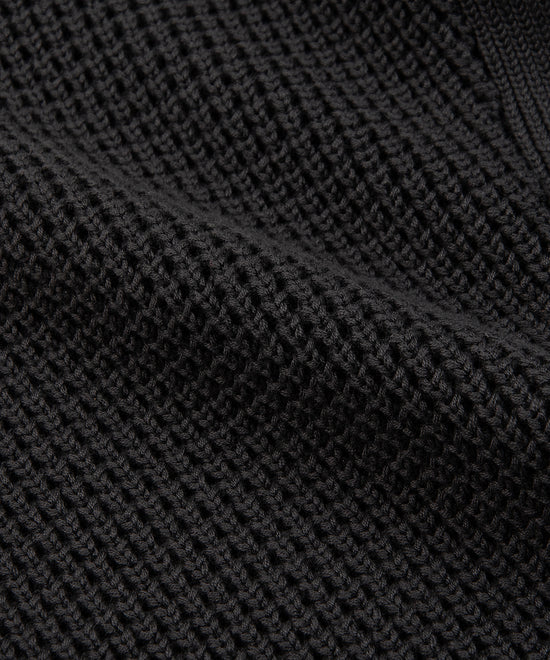 CUSTOM_ALT_TEXT: Closeup of waffle stitch on Paper Planes Sweater Knit Jogger, color Pirate Black.