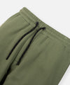 CUSTOM_ALT_TEXT: Elasticated waistband with exterior drawcord on Paper Planes Logo Jacquard Pant, color Bronze Green.