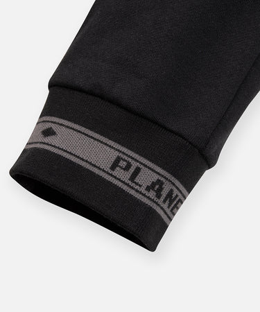 CUSTOM_ALT_TEXT: Tonal jacquard flat knit rib cuff on Paper Planes Logo Jacquard Pant, color Black