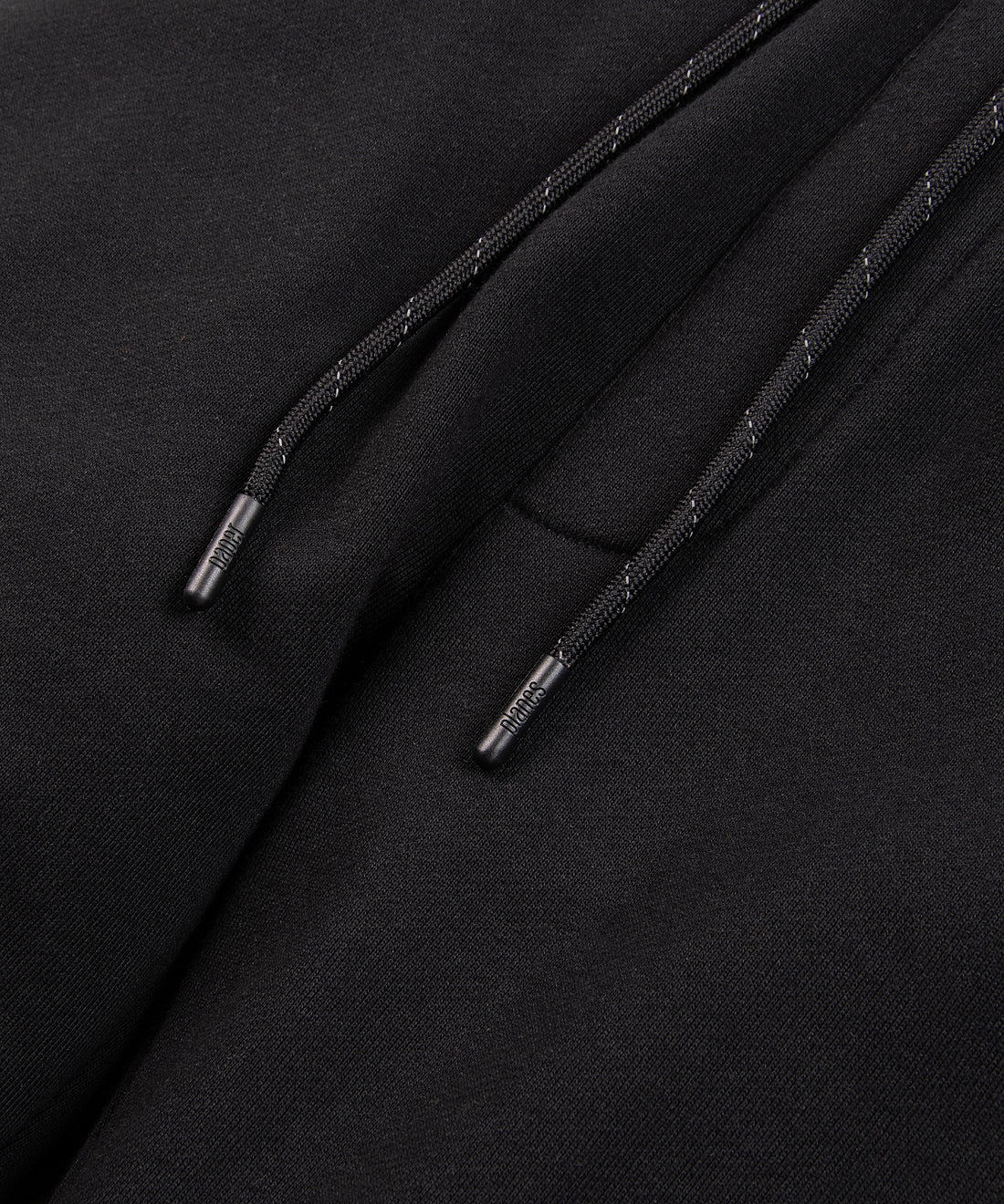 CUSTOM_ALT_TEXT: Drawcord on Paper Planes Logo Jacquard Pant, color Black.
