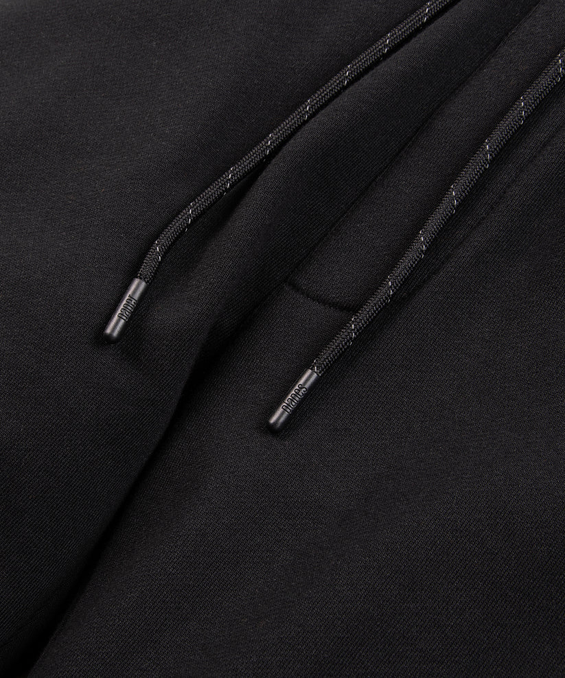 CUSTOM_ALT_TEXT: Drawcord on Paper Planes Logo Jacquard Pant, color Black.
