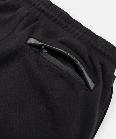 CUSTOM_ALT_TEXT: Single welt back pocket with hidden reverse coil zipper closure on Paper Planes Logo Jacquard Pant, color Black.