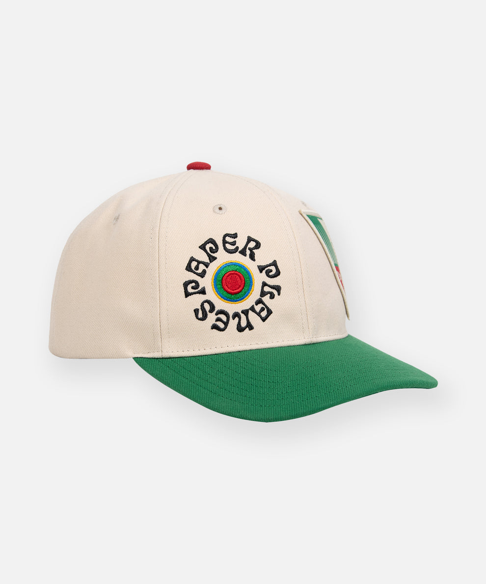 CUSTOM_ALT_TEXT: Embroidery detail and green visor on Paper Planes Unstructured Snapback Hat.