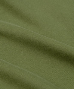 CUSTOM_ALT_TEXT: Closeup of French terry fabric on Paper Planes Logo Jacquard Hoodie, color Bronze Green.