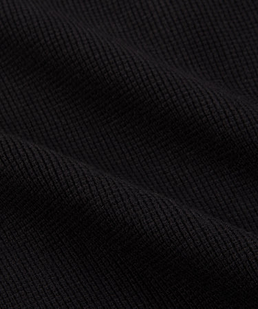 CUSTOM_ALT_TEXT: Waffle half cardigan stitch body on Paper Planes Sweater Track Jacket, color Black.