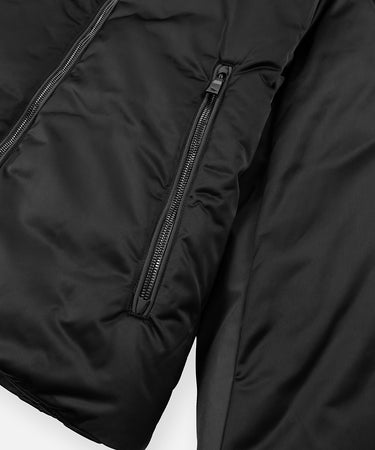 CUSTOM_ALT_TEXT: Mirror-like zippered pocket on Paper Planes Puffer Jacket, color Black.