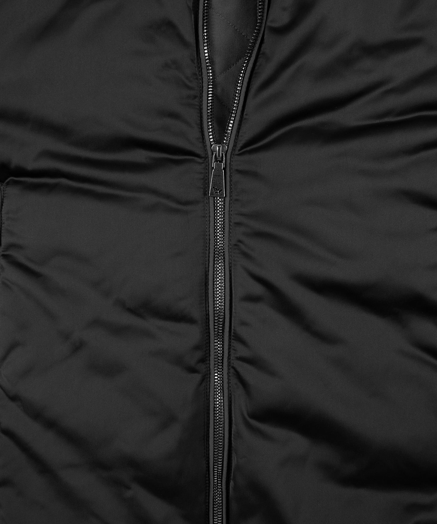 CUSTOM_ALT_TEXT: Mirror-like front zipper closure with Plane knockout logo pull on Paper Planes Puffer Jacket, color Black.