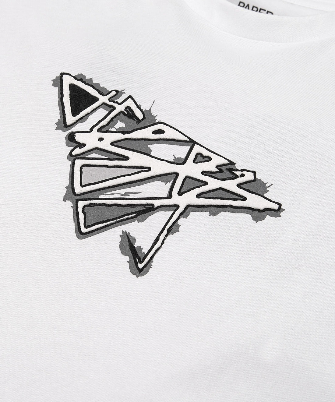 CUSTOM_ALT_TEXT: Closeup of Plane print artwork on Paper Planes Warped Tee, color White.