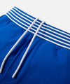 CUSTOM_ALT_TEXT: Striped rib waistband with drawcord on Paper Planes Gusset Short color Nautical Blue.