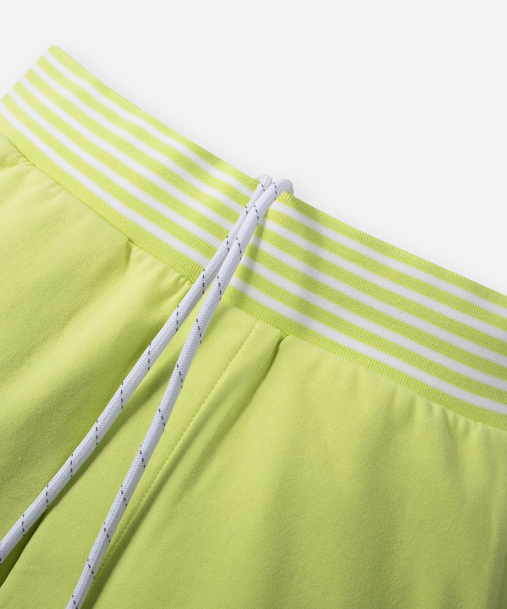 CUSTOM_ALT_TEXT: Striped rib waistband with drawcord on Paper Planes Gusset Short color Lime Sherbet.