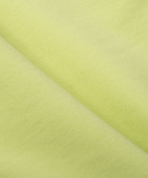CUSTOM_ALT_TEXT: French terry closeup on Paper Planes Gusset Short color Lime Sherbet.