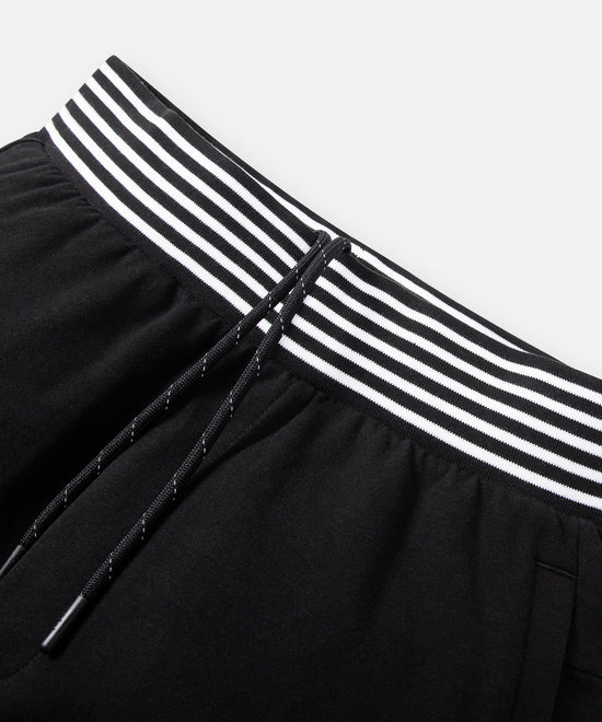 CUSTOM_ALT_TEXT: Striped rib waistband with drawcord on Paper Planes Gusset Short color Black.
