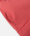 CUSTOM_ALT_TEXT: On-seam front pocket on Paper Planes Super Cargo Knit Short color Mineral Red.